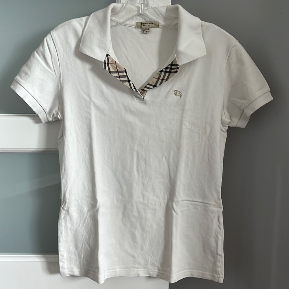 Burberry polo with peek-a-boo vintage check accent.